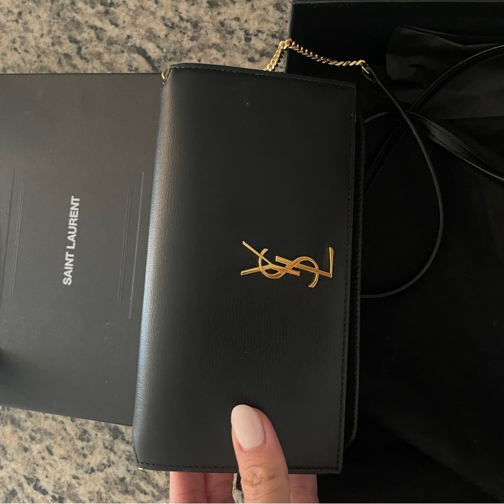 YSL crossbody clutch.